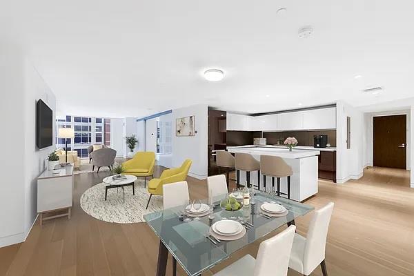 135 W 52nd St Unit 8D, New York Manhattan, NY 10019 - dining room with light wood-style flooring and baseboards