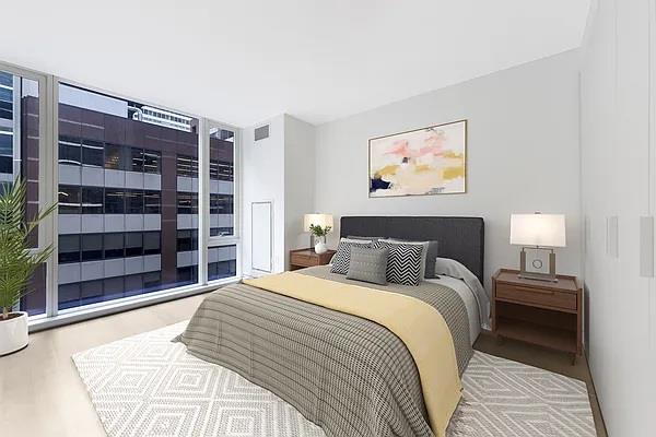 135 W 52nd St Unit 8D, New York Manhattan, NY 10019 - bedroom featuring wood finished floors