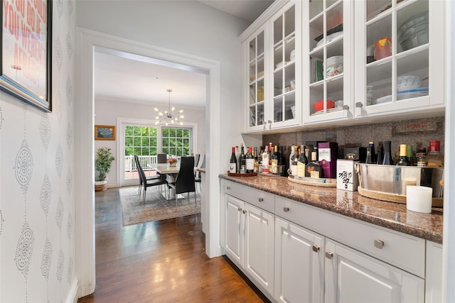 19 Rock Hill Ln, Scarsdale, NY 10583 - bar with backsplash, dark wood-style floors, a chandelier, and ornamental molding