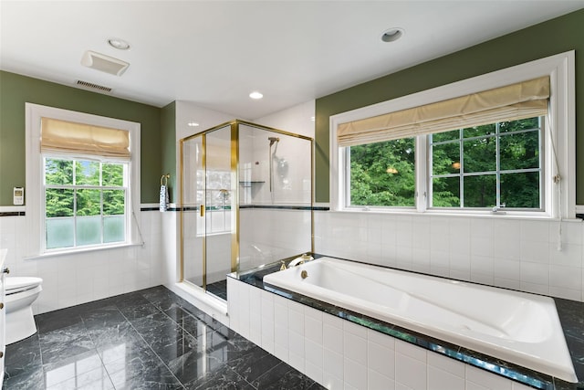 19 Rock Hill Ln, Scarsdale, NY 10583 - bathroom with tile walls, a bath, a shower stall, toilet, and recessed lighting