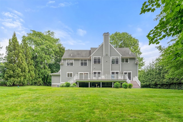 19 Rock Hill Ln, Scarsdale, NY 10583 - rear view of property with a wooden deck, a chimney, a lawn, and stairway