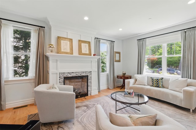 9 Constance Ave, Dobbs Ferry, NY 10522 - living room featuring plenty of natural light, a tile fireplace, baseboards, recessed lighting, and light wood-style flooring