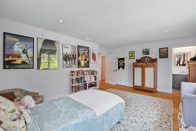 9 Constance Ave, Dobbs Ferry, NY 10522 - bedroom with light wood finished floors, recessed lighting, baseboards, and ensuite bath