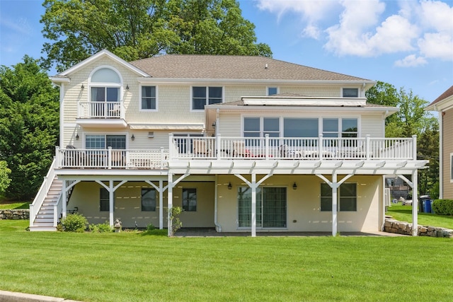 9 Constance Ave, Dobbs Ferry, NY 10522 - back of house featuring a deck, a lawn, stairway, and a shingled roof