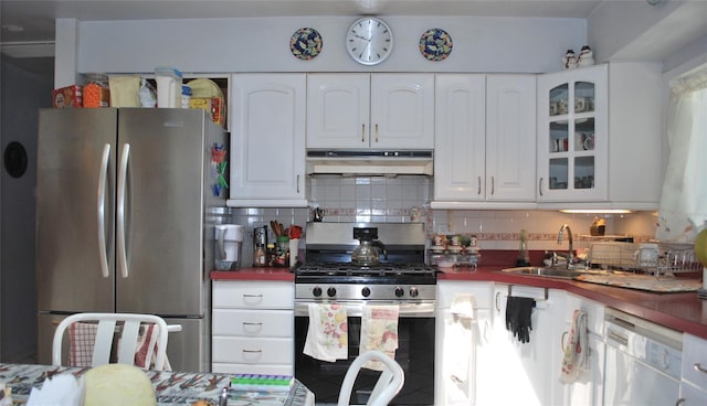 4026 208th St, Bayside, NY 11361 - kitchen with appliances with stainless steel finishes, under cabinet range hood, white cabinets, and backsplash