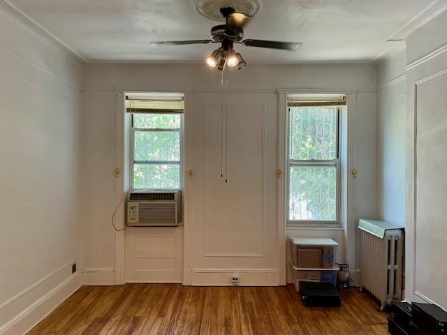 32-17 46th St, Astoria, NY 11103 - entryway with radiator, cooling unit, wood finished floors, and a ceiling fan