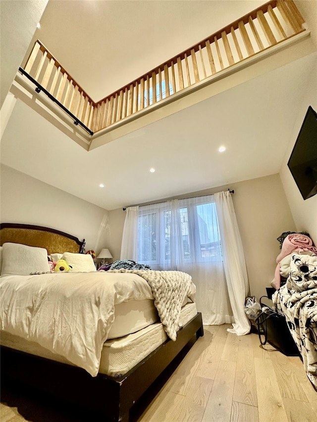 2564 38th St, Astoria, NY 11103 - bedroom with light wood-type flooring and recessed lighting