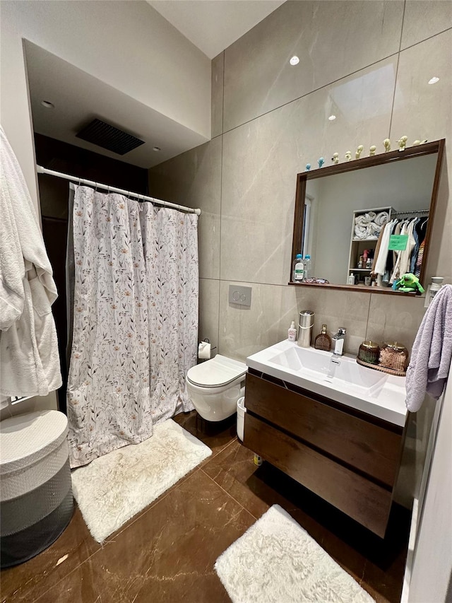 2564 38th St, Astoria, NY 11103 - full bath featuring tile walls, vanity, a shower with curtain, toilet, and decorative backsplash