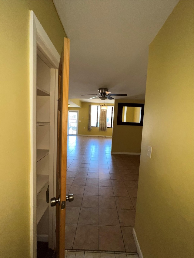 1044 E 96th St, Brooklyn, NY 11236 - corridor with tile patterned floors, baseboards, and built in shelves