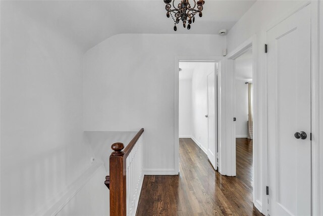 7931 211th St, Oakland Gardens, NY 11364 - hall featuring an upstairs landing, dark wood-type flooring, and a chandelier