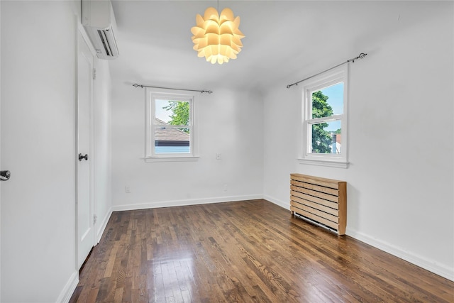 7931 211th St, Oakland Gardens, NY 11364 - unfurnished bedroom featuring multiple windows, dark wood-type flooring, a wall mounted air conditioner, and baseboards