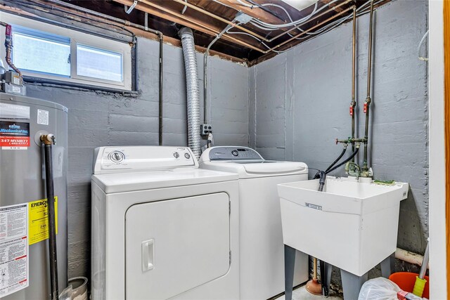 7931 211th St, Oakland Gardens, NY 11364 - laundry area with gas water heater and independent washer and dryer