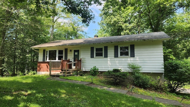 48 Julie Dr, Hopewell Junction, NY 12533 - view of front facade featuring a front yard and a chimney