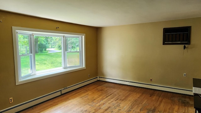 48 Julie Dr, Hopewell Junction, NY 12533 - empty room with a baseboard heating unit and wood finished floors