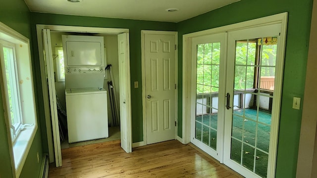 48 Julie Dr, Hopewell Junction, NY 12533 - doorway to outside featuring stacked washer / dryer, french doors, and light wood finished floors