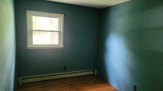 48 Julie Dr, Hopewell Junction, NY 12533 - empty room featuring baseboard heating and wood finished floors
