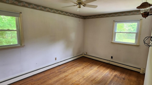 48 Julie Dr, Hopewell Junction, NY 12533 - empty room with a baseboard radiator, a ceiling fan, and wood finished floors