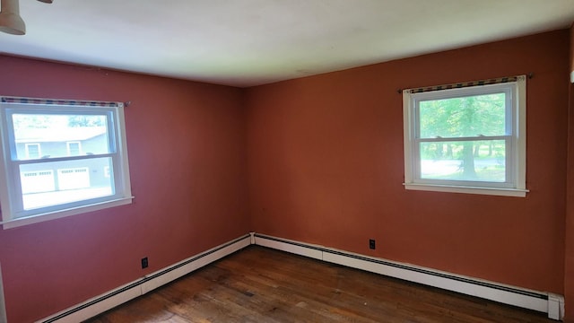48 Julie Dr, Hopewell Junction, NY 12533 - spare room with baseboard heating, healthy amount of natural light, and wood finished floors