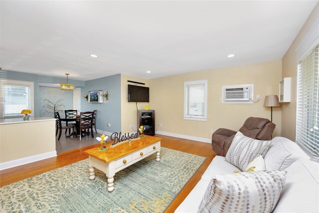 27 Armour St, Long Beach, NY 11561 - living area featuring a wall mounted AC, plenty of natural light, wood finished floors, baseboards, and recessed lighting