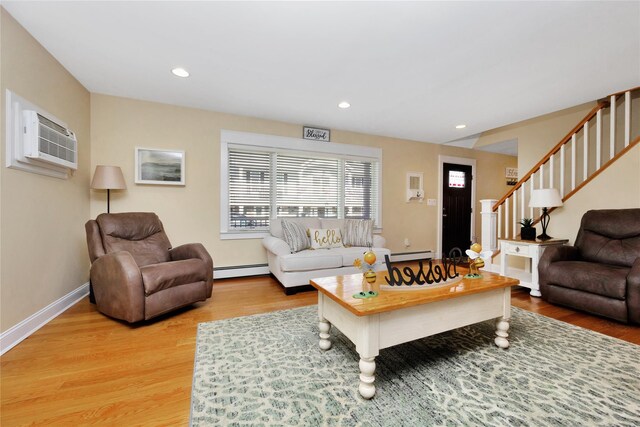 27 Armour St, Long Beach, NY 11561 - living room with baseboard heating, a wall unit AC, light wood-style flooring, and recessed lighting