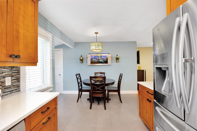 27 Armour St, Long Beach, NY 11561 - dining room with baseboards, a chandelier, light tile patterned flooring, and beamed ceiling