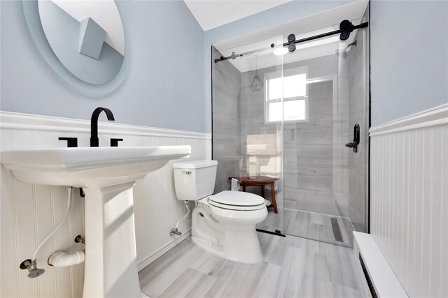 27 Armour St, Long Beach, NY 11561 - full bath with toilet, a shower stall, and a wainscoted wall