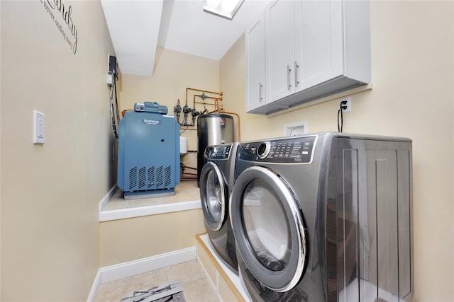 27 Armour St, Long Beach, NY 11561 - washroom featuring independent washer and dryer, cabinet space, light tile patterned floors, water heater, and baseboards