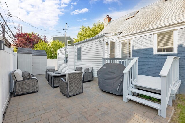 27 Armour St, Long Beach, NY 11561 - fenced backyard with a patio, area for grilling, a wooden deck, and an outdoor hangout area