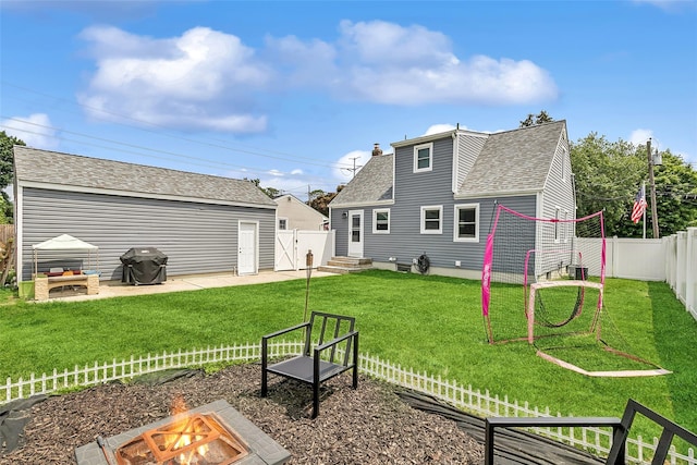 26 Richard Ave, Ronkonkoma, NY 11779 - rear view of house featuring a fire pit, a fenced backyard, a patio, and a shingled roof
