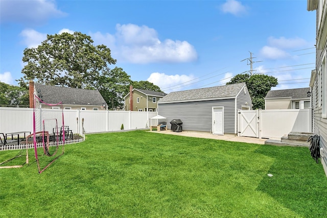 26 Richard Ave, Ronkonkoma, NY 11779 - fenced backyard with a gate and a patio