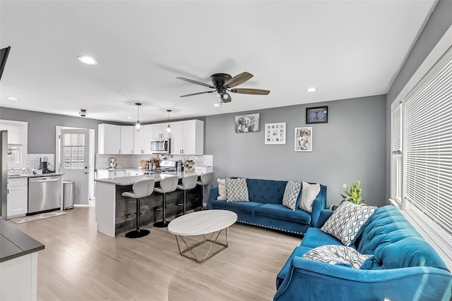 26 Richard Ave, Ronkonkoma, NY 11779 - living room featuring recessed lighting, light wood finished floors, and a ceiling fan