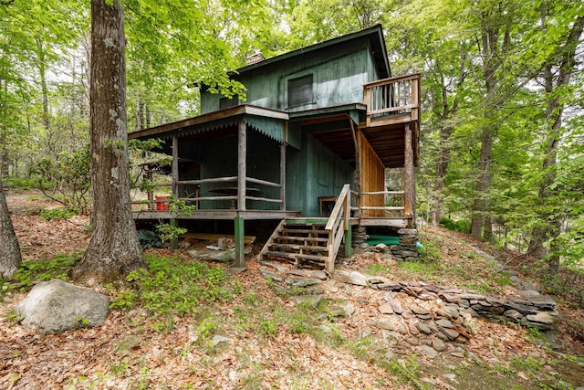 215 Little Pond Rd, Pawling, NY 12564 - view of front of house with a forest view, a deck, and stairs
