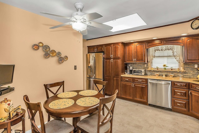 1197 Tulip Ave, Franklin Square, NY 11010 - kitchen featuring stainless steel appliances, backsplash, and a ceiling fan