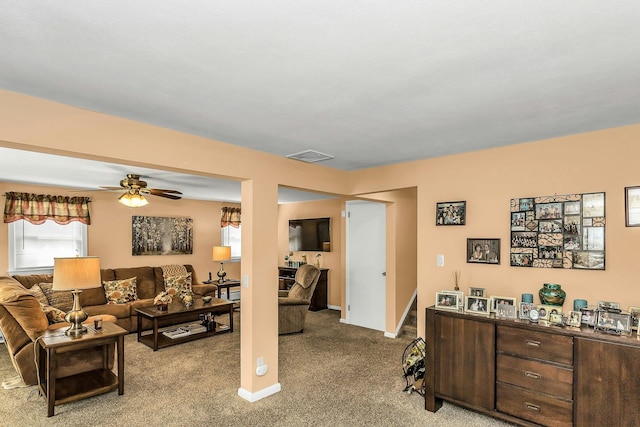 1197 Tulip Ave, Franklin Square, NY 11010 - living room featuring light colored carpet, a ceiling fan, and baseboards