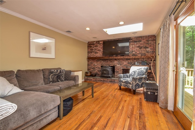 12 Cordwood Path, Shoreham, NY 11786 - living room featuring a wood stove, hardwood / wood-style floors, a skylight, crown molding, and recessed lighting