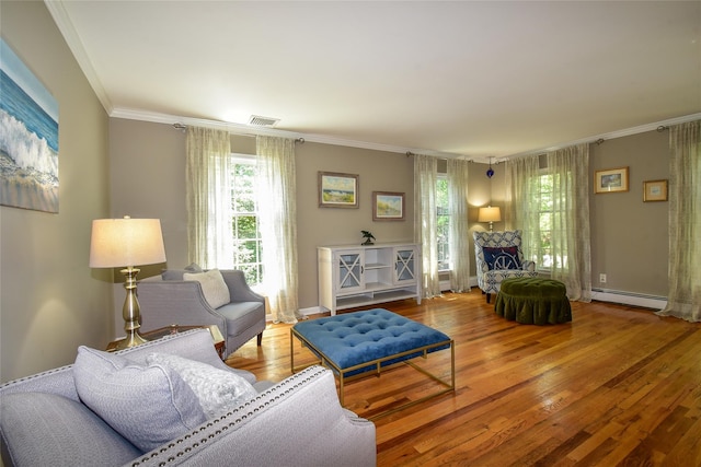 12 Cordwood Path, Shoreham, NY 11786 - living area featuring a baseboard radiator, wood finished floors, ornamental molding, and baseboards