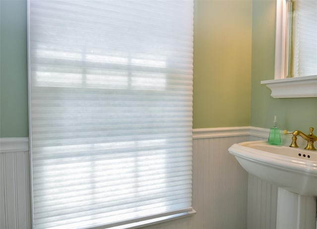 12 Cordwood Path, Shoreham, NY 11786 - bathroom with wainscoting and a sink