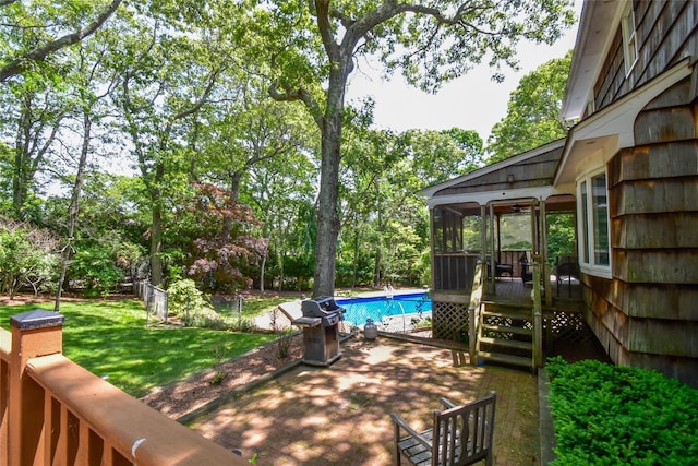 12 Cordwood Path, Shoreham, NY 11786 - view of patio / terrace with a deck, area for grilling, a sunroom, and view of wooded area