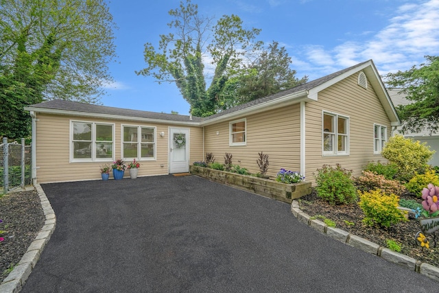 138 Greene Ave, Port Jefferson Station, NY 11776 - single story home with a patio and asphalt driveway