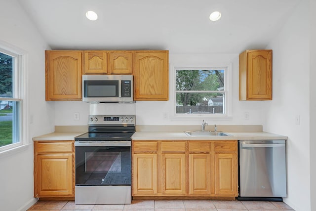 138 Greene Ave, Port Jefferson Station, NY 11776 - kitchen featuring appliances with stainless steel finishes, a sink, light countertops, baseboards, and recessed lighting