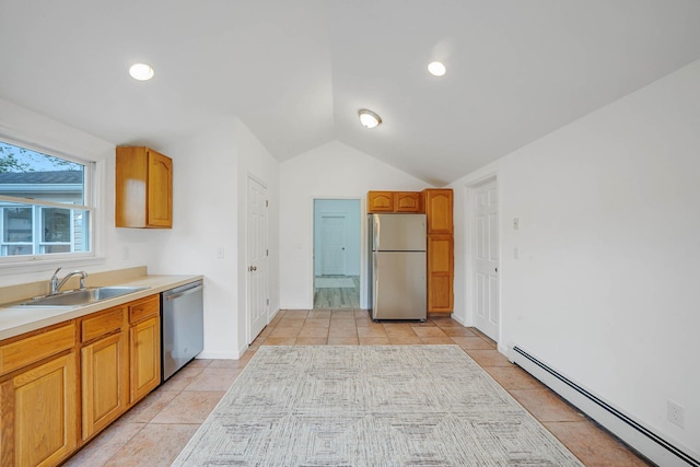 138 Greene Ave, Port Jefferson Station, NY 11776 - kitchen featuring stainless steel appliances, a baseboard radiator, a sink, lofted ceiling, and light tile patterned floors
