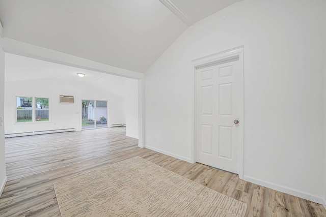 138 Greene Ave, Port Jefferson Station, NY 11776 - spare room with vaulted ceiling, a baseboard radiator, wood finished floors, a wall mounted AC, and baseboards