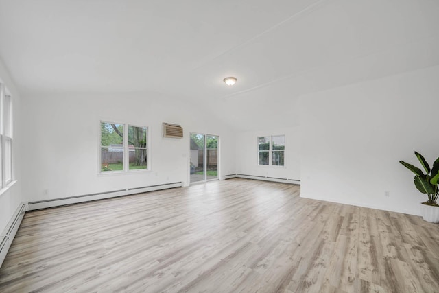 138 Greene Ave, Port Jefferson Station, NY 11776 - unfurnished living room featuring a baseboard radiator, wood finished floors, healthy amount of natural light, and lofted ceiling