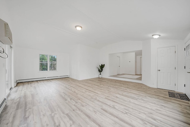 138 Greene Ave, Port Jefferson Station, NY 11776 - unfurnished living room with a baseboard radiator, vaulted ceiling, wood finished floors, and a wall unit AC