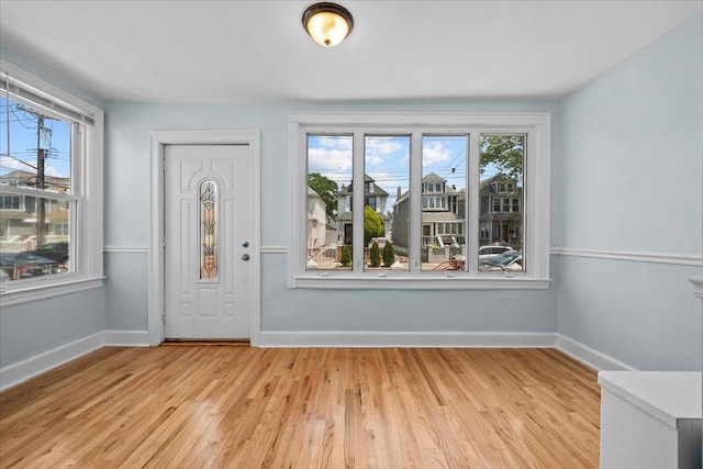 11148 128th St, South Ozone Park, NY 11420 - entryway with light wood-type flooring and baseboards