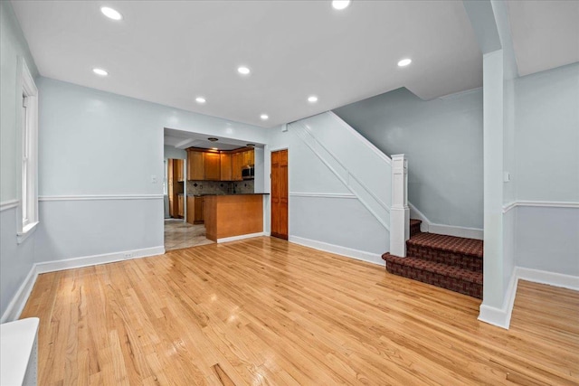 11148 128th St, South Ozone Park, NY 11420 - unfurnished living room featuring stairs, light wood finished floors, baseboards, and recessed lighting