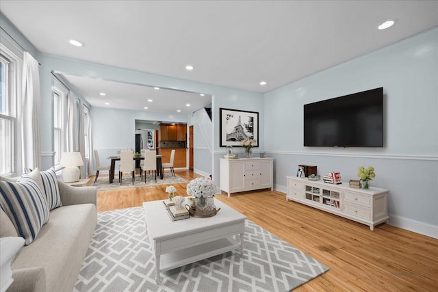 11148 128th St, South Ozone Park, NY 11420 - living area featuring light wood-style flooring, baseboards, and recessed lighting