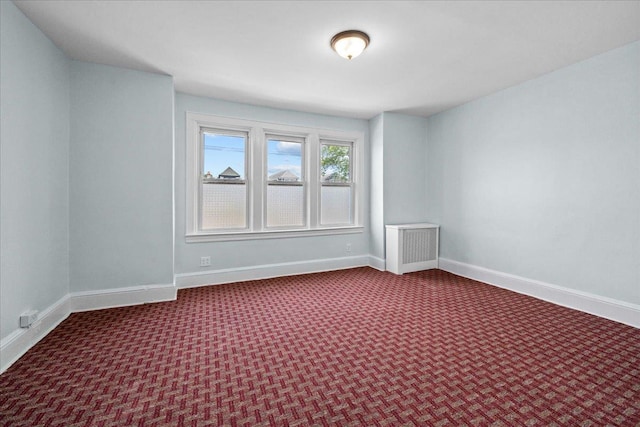 11148 128th St, South Ozone Park, NY 11420 - unfurnished room with baseboards and carpet