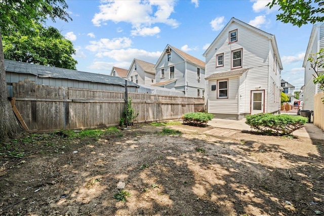 11148 128th St, South Ozone Park, NY 11420 - rear view of property featuring a fenced backyard and a residential view