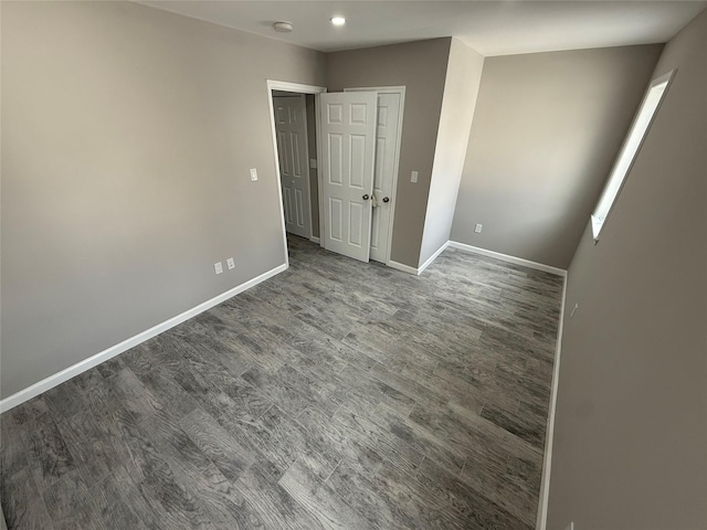 10917 124th St, South Ozone Park, NY 11420 - unfurnished bedroom with baseboards and wood finished floors